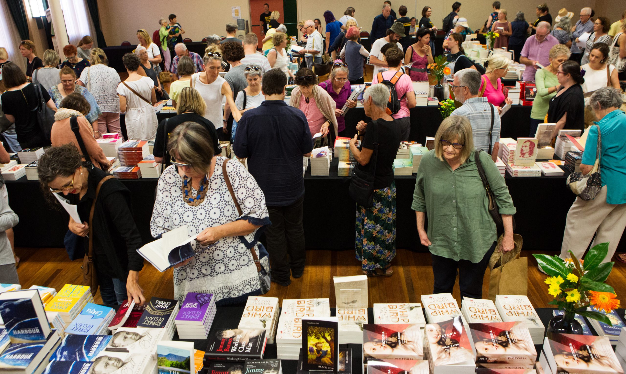 Festival attendees browsing books at the Newcastle Writers Festival